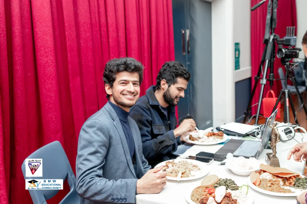 Crew enjoying a meal with the camera rig set up behind them