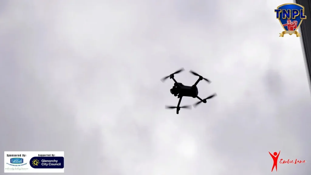 Our drone in the air above the ground, filming aerial shots