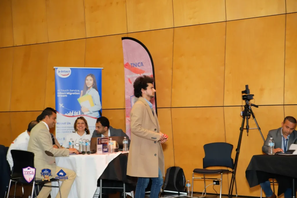 Camera on a tripod filming interviews at an education expo