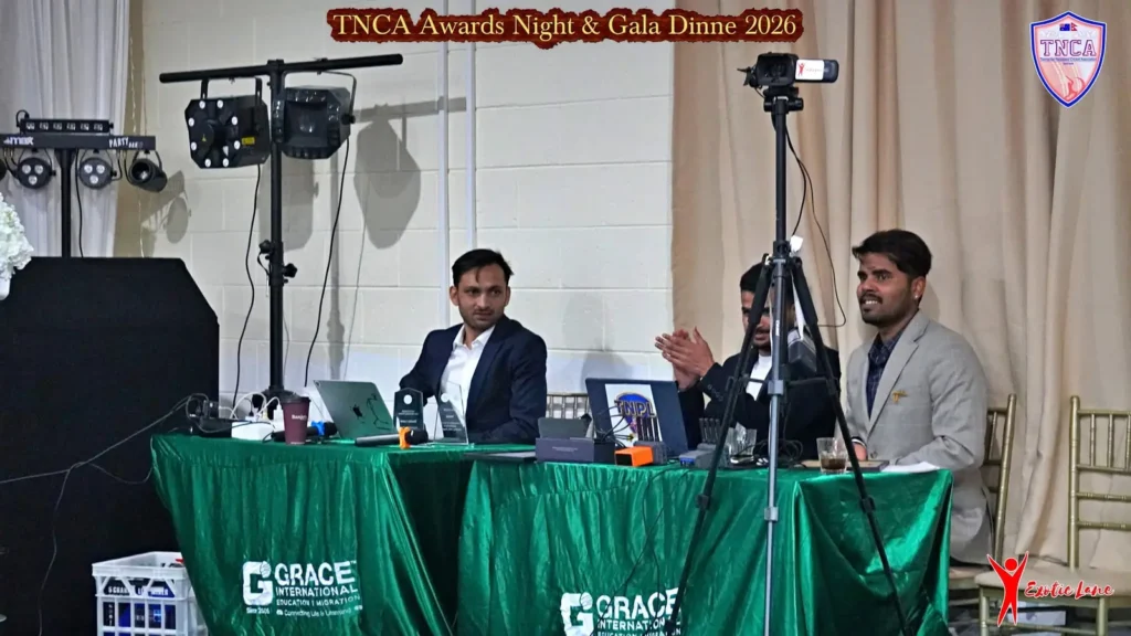 Production desk with cameras and stage lights at a gala dinner