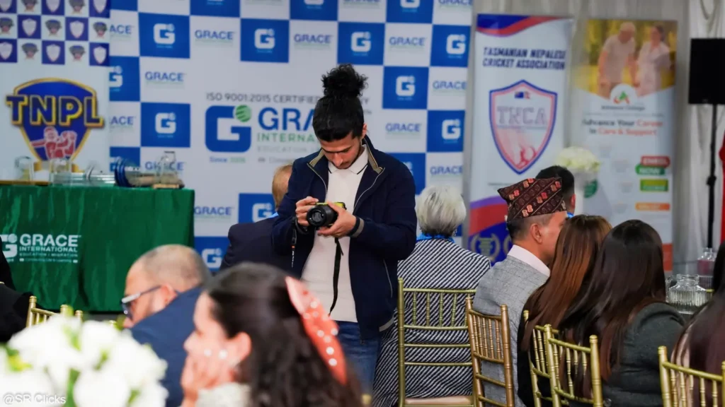 Photographer shooting the stage at an awards event